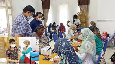 SUNTIK VAKSIN SINOVAC — Peserta vaksinasi Covid-19 di DPD Gerindra Sumbar mendapatkan suntikan vaksin Sinovac di kantor Gerindra Sumbar.