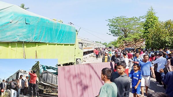DITABRAK KERETA API— Truk bermuatan semen tertabrak kereta api di simpang Puskesmas Anak Air, hingga mengakibatkan billboard roboh menimpa mobil dan menutupi badan jalan.