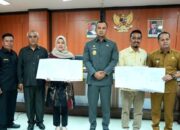 Bupati Sijunjung Bersama KPU dan Bawaslu, Tandatangani NPHD Pilkada Tahun 2024