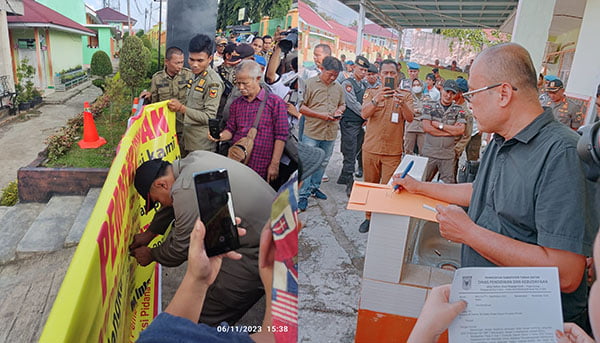 Ulah Sengketa Lahan, Dua Sekolah Disegel Warga, Siswa Terpaksa Belajar di Pustaka Daerah, Bupati Berang, Dibuka Paksa Satpol PP 1 BUKA SEGEL— Satpol PP dan instansi terkait membuka spanduk dan gembok sekolah yang dipasang oleh warga yang mengklaim sebagai pemilik tanah. Setelah itu, Pemkab memasang pengumuman di pagar sekolah SMP 2 Batusangkar.