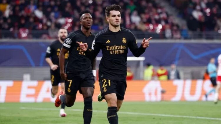 RAYAKAN GOL— Brahim Diaz dan Vinicius merayakan gol saat menghadapi RB Leipzig di leg pertama babak 16 besar Liga Champions yang berlangsung di Red Bull Arena Leipzig pada Rabu (14/1) dini hari.