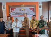 Pj Wako Roberia Tanda Tangani NPHD Pengamanan Pilkada Serentak 2024