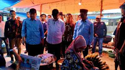 Borong Dagangan, Mahyeldi Ajak Pengunjung Pasar Raya Sungai Tambang Hindari Pinjol 1 download 20