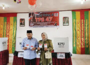 Bupati Agam dan Istri Berikan Hak Pilih di TPS 47, Ajak Warga Wujudkan Demokrasi Damai