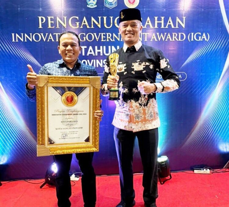 Kota Pariaman Kembali Terima Penghargaan IGA Tahun 2024 1 TERIMA PENGHARGAAN—Pj Wali Kota Pariaman Roberia saat terima penghargaan IGA 2024.