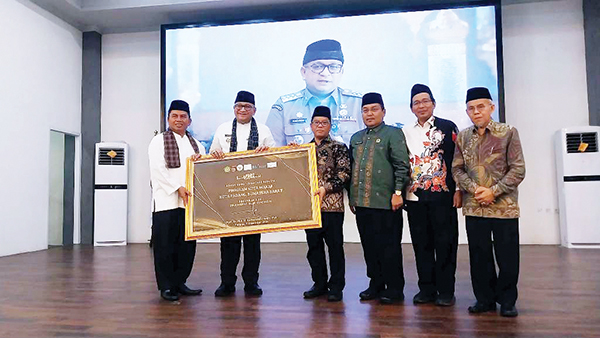 Pemko Padang Perkuat Kolaborasi Optimalkan Potensi Wakaf 1 KOTA WAKAF— Dirjen Bimas Islam Kemenag RI Kamaruddin Amin, meluncurkan secara resmi Padang sebagai Kota Wakaf, di Gedung Bagindo Aziz Chan, Rabu (11/12).